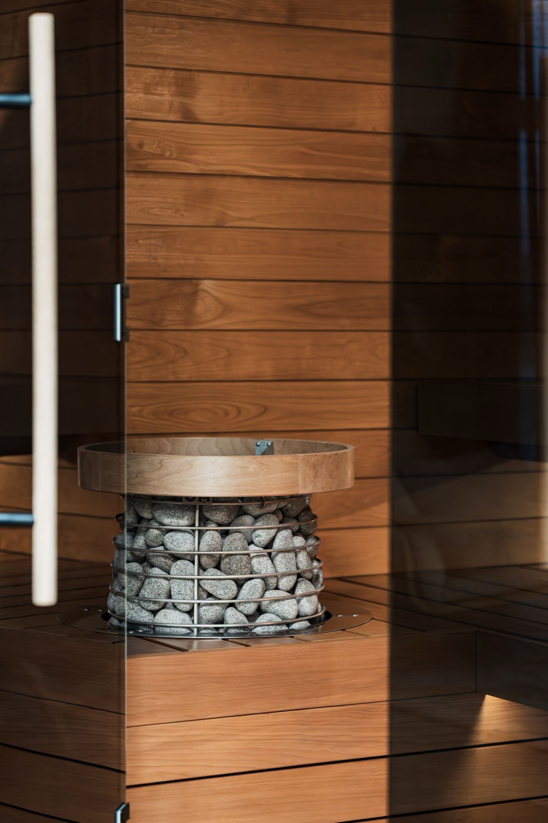 Modern cedar sauna with stone heater